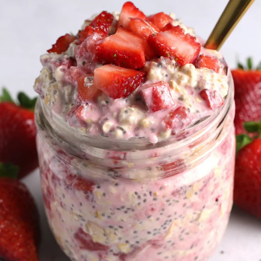 A jar of strawberries and cream overnight oats.